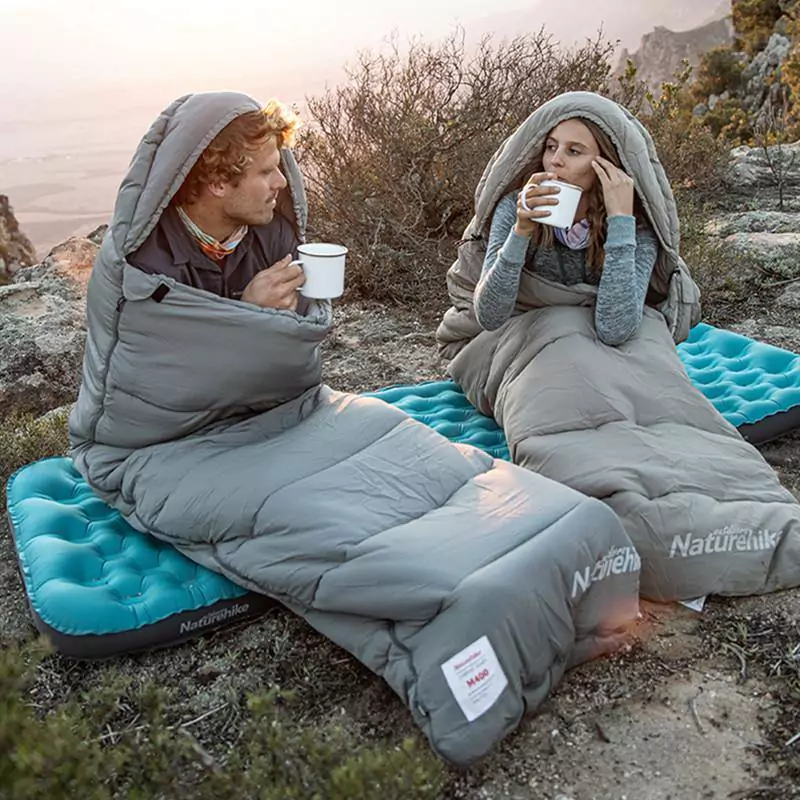 image of couple in sleeping bags